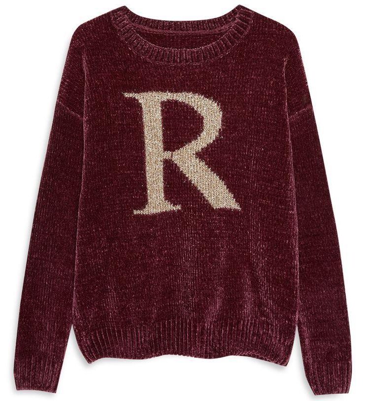  Ron's sparkly jumper is a festive maroon shade