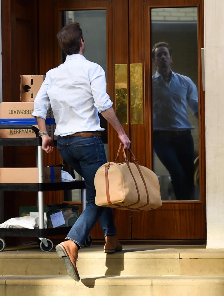  Pippa's husband, James, pictured running into the Lindo Wing today with a bag