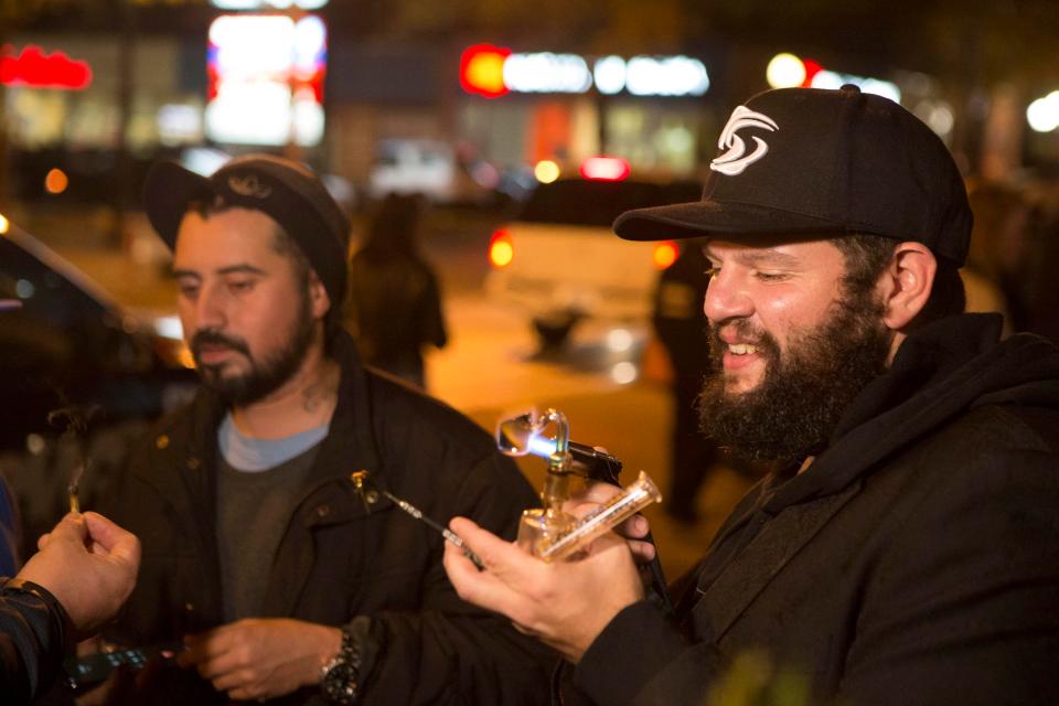  Smokers light up in Toronto to celebrate the historic day