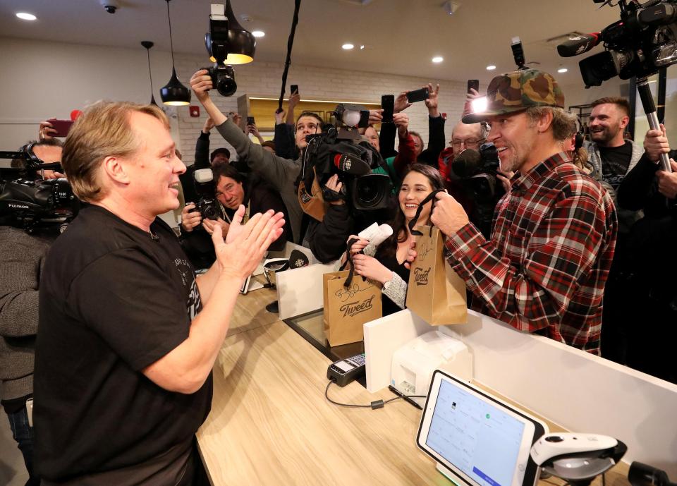  Customers cheer as the first sale is made in the store in Newfoundland