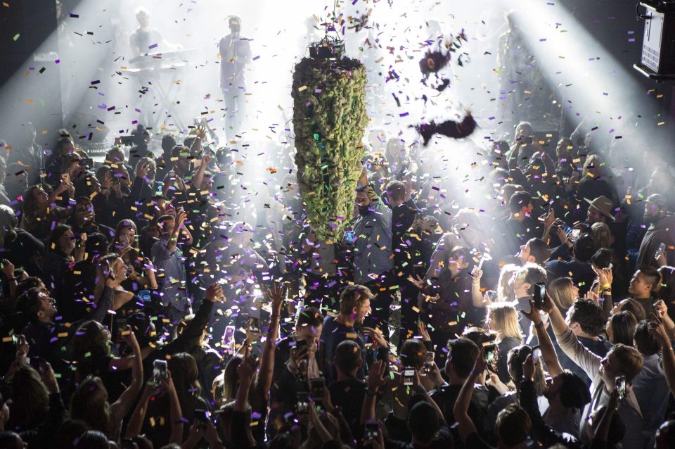  A depiction of a cannabis bud drops from the ceiling at Leafly's countdown party in Toronto