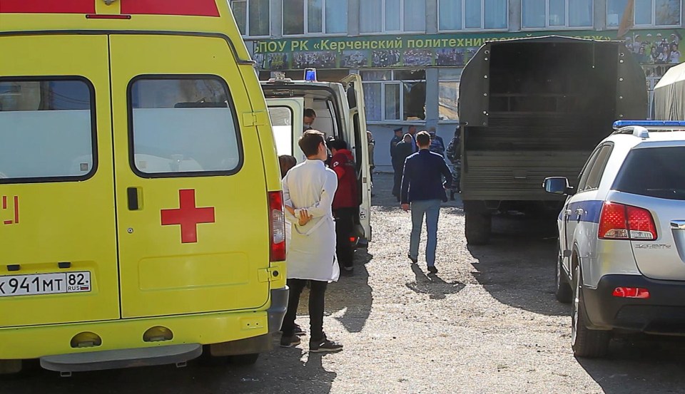 Ambulance and police vehicles at the site of a bomb blast at a college in the Crimean city of Kerch