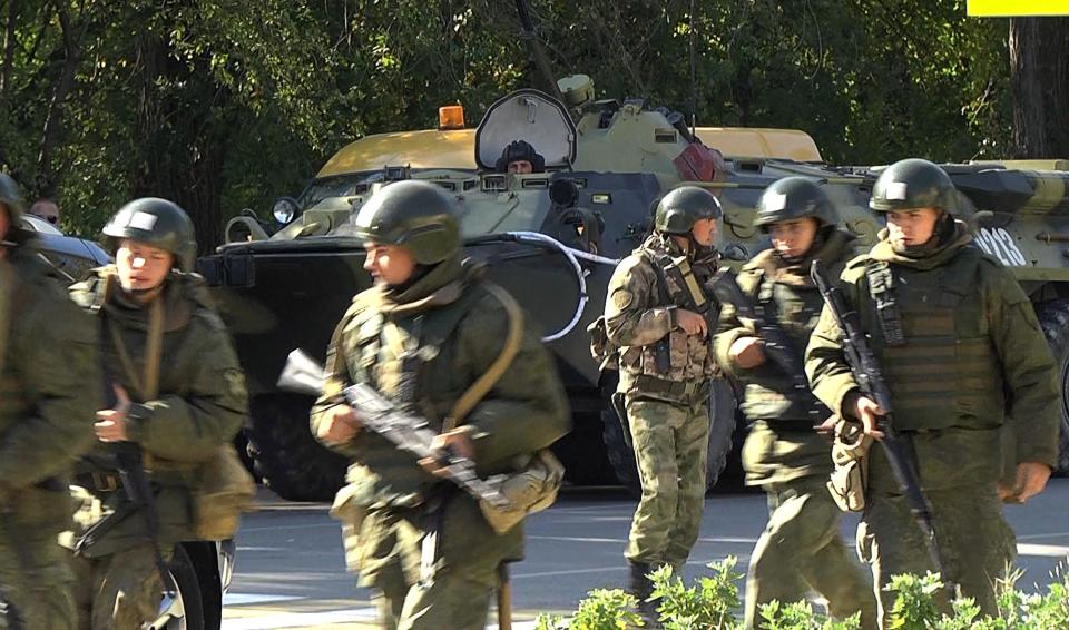  Federal National Guard officers near the building of the Kerch Polytechnic Vocational School