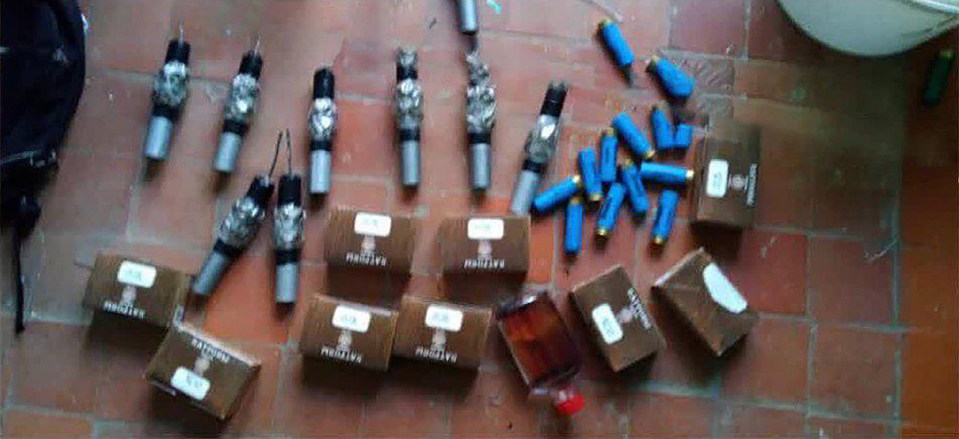 Police have released pictures of numerous fuse lit bombs and bullets were found by police at the scene