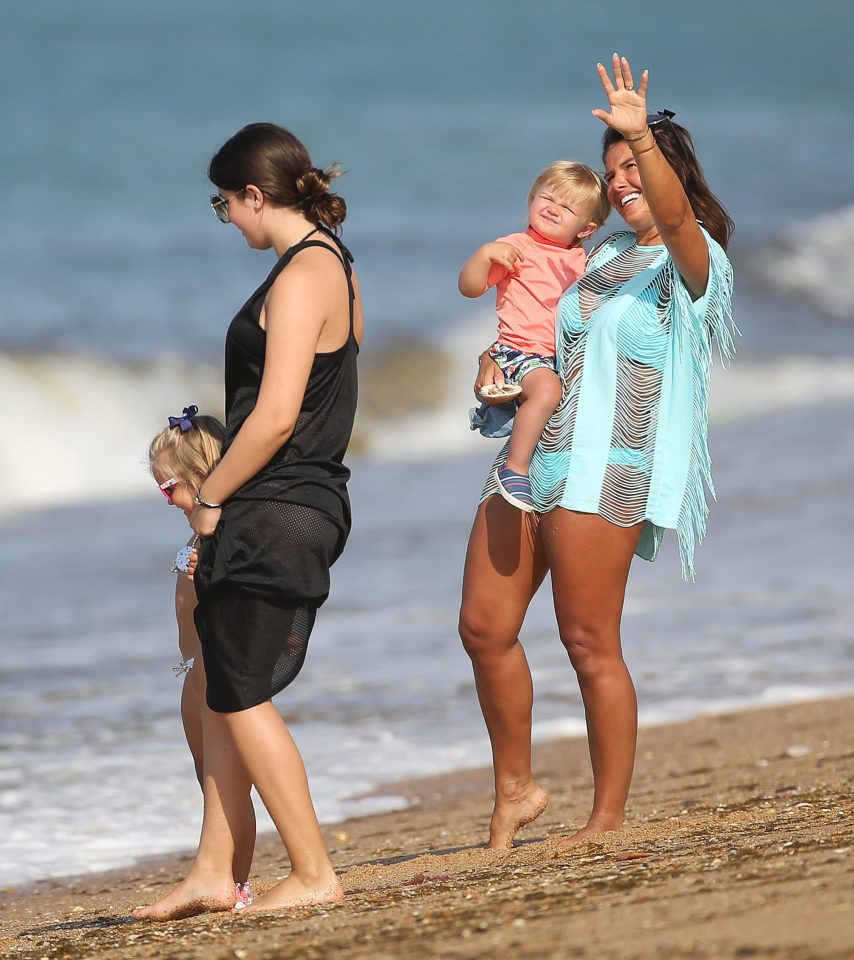  Rebekah was joined on the beach by her eldest daughter, Megan, 12