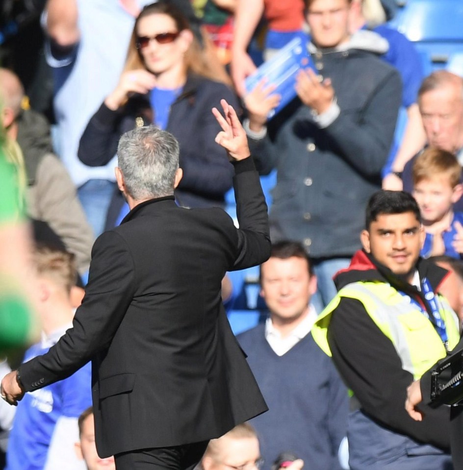 Jose Mourinho responds to taunts from Chelsea fans by raising three fingers to remind them how many titles they won when he was boss