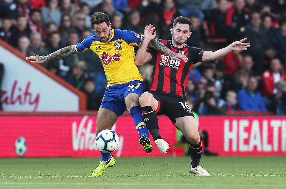  Danny Ings and Lewis Cook battle for the ball