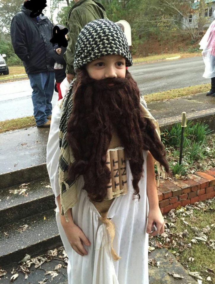  This child dressed up carrying a TNT lookalike explosive bomb prop