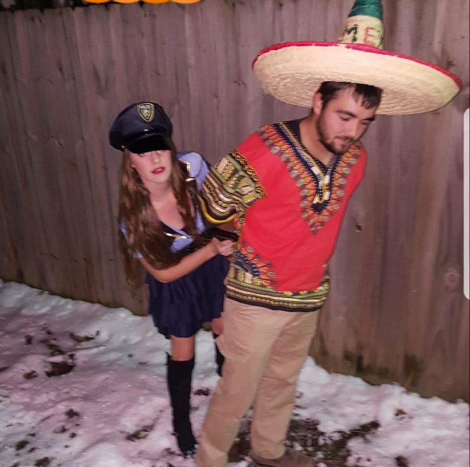  This couple dressed up like a Mexican man in a sombrero, and a policewoman who is detaining him