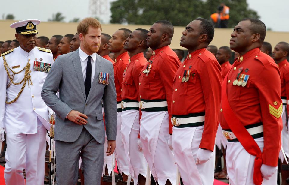  Prince Harry inspects a guard of honour at their official welcome ceremony in Suva