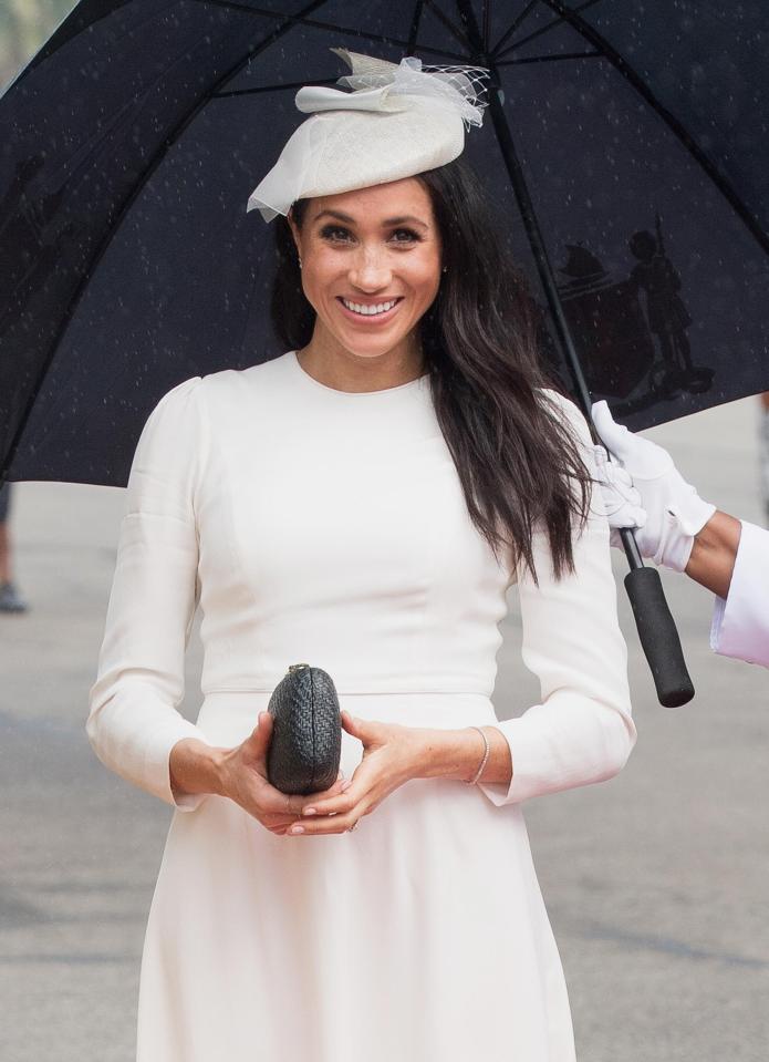  Meghan looked thrilled by the warm welcome the royal couple received