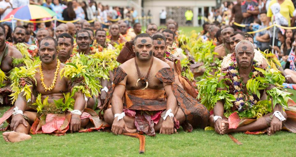  Men in traditional dress greeted the royal couple in a welcome ceremony