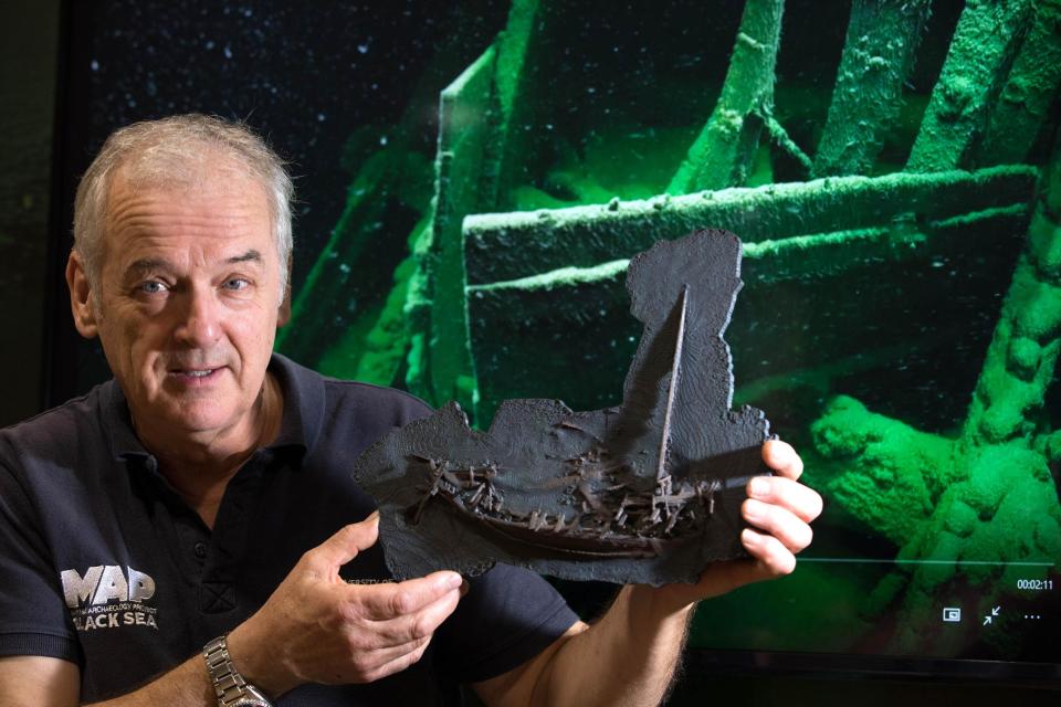  Professor Jon Adams, who headed up the investigation, is seen here holding a 3D printed replica of a piece of the boat