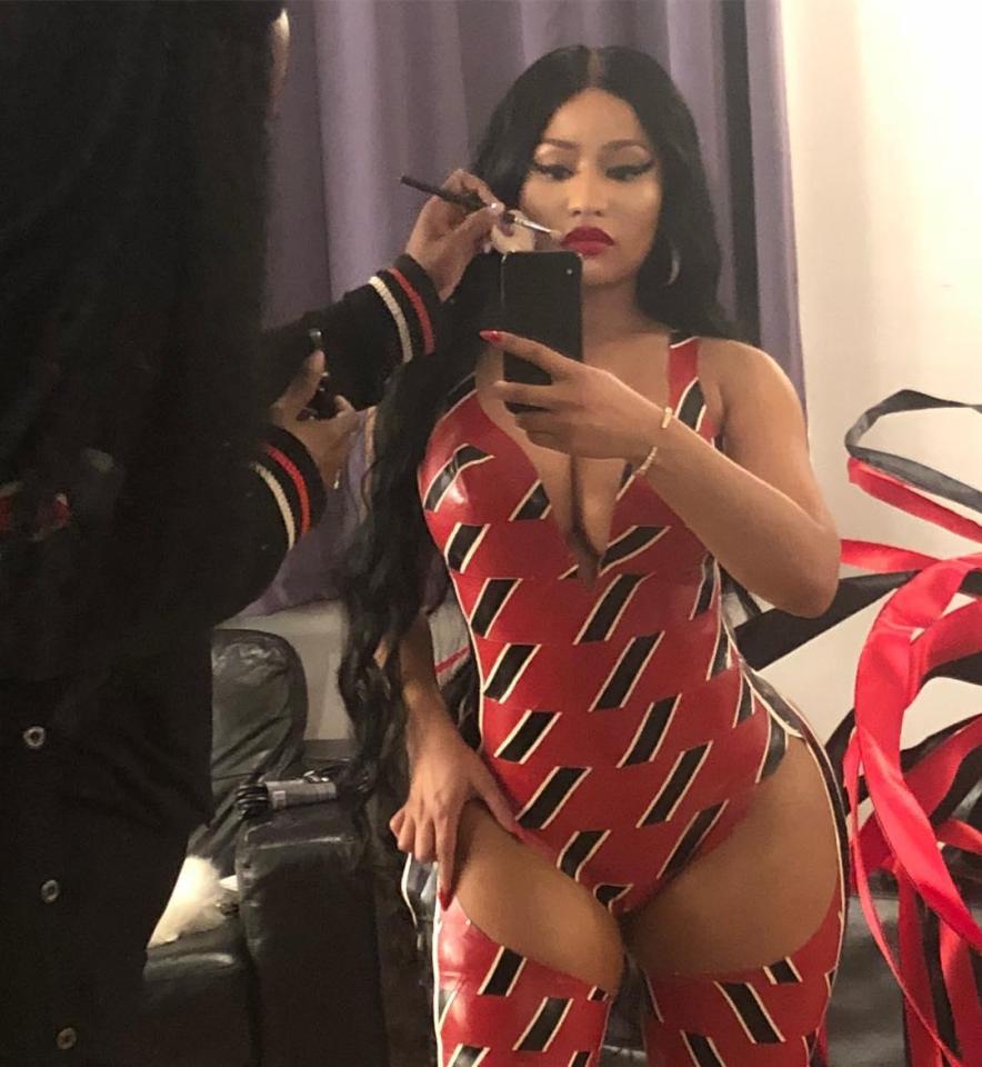  Nicki Minaj wowed her fans in a latex bodysuit and matching thigh high boots