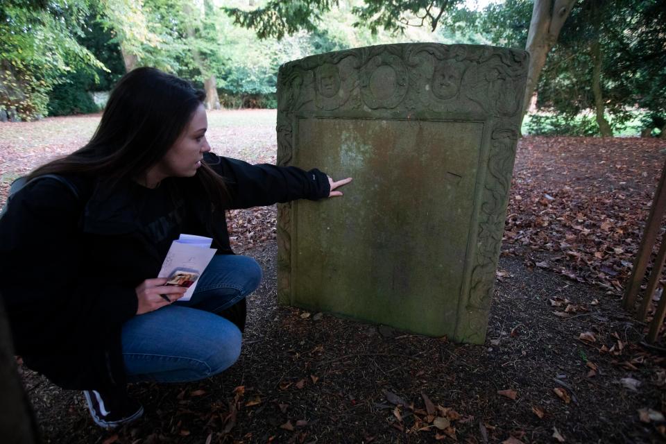 Nicola checks one of the graves in the hotel grounds