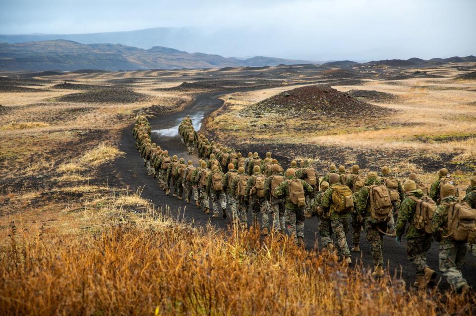  Marines hike to a cold-weather training site inland in Iceland during Trident Juncture