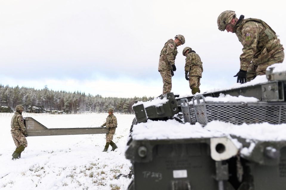  Members of the Royal Engineers take part in a bridge-building exercise