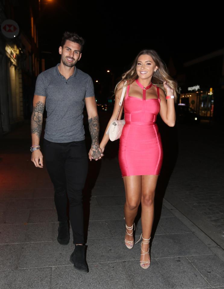  Zara wore a pink dress while Adam wore a tight grey T-shirt and black jeans.