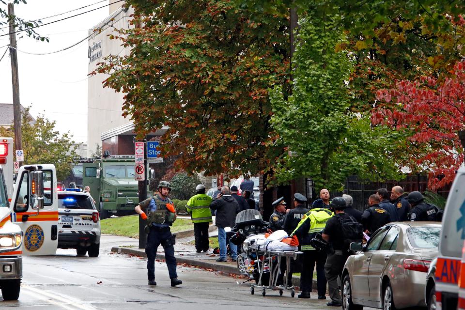  Ambulance crews prepare to evacuate wounded from the synagogue