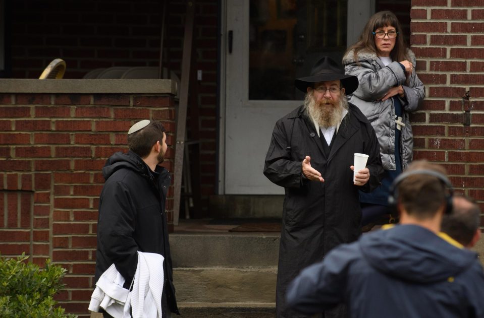  Residents talk to the media near the site of a mass shooting at the Tree of Life Synagogue