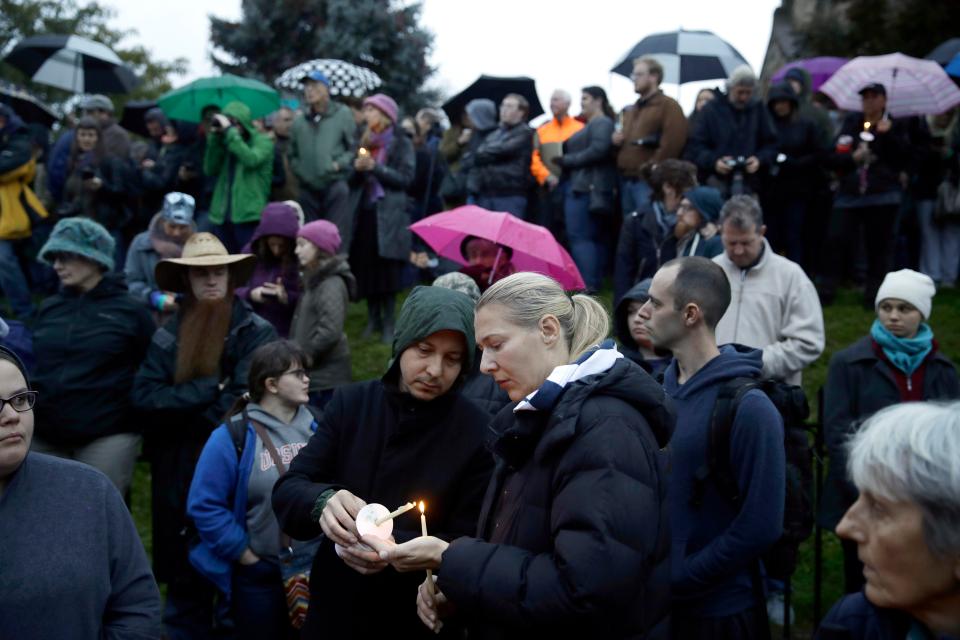  People gather for a vigil in the aftermath of the deadly shooting in Pittsburgh