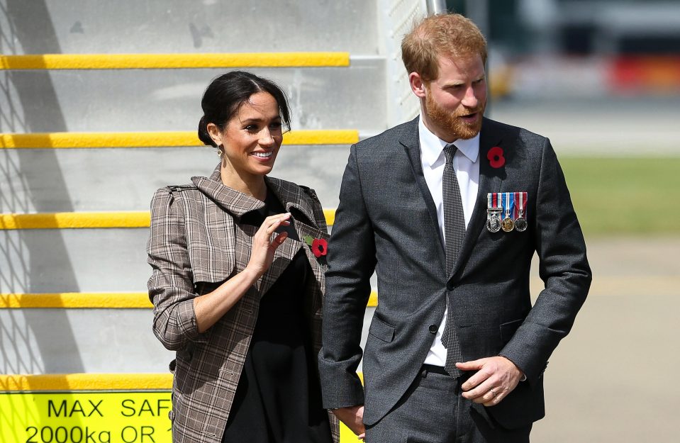  Meghan changed into an ASOS maternity dress and a Karen Walker trench coat