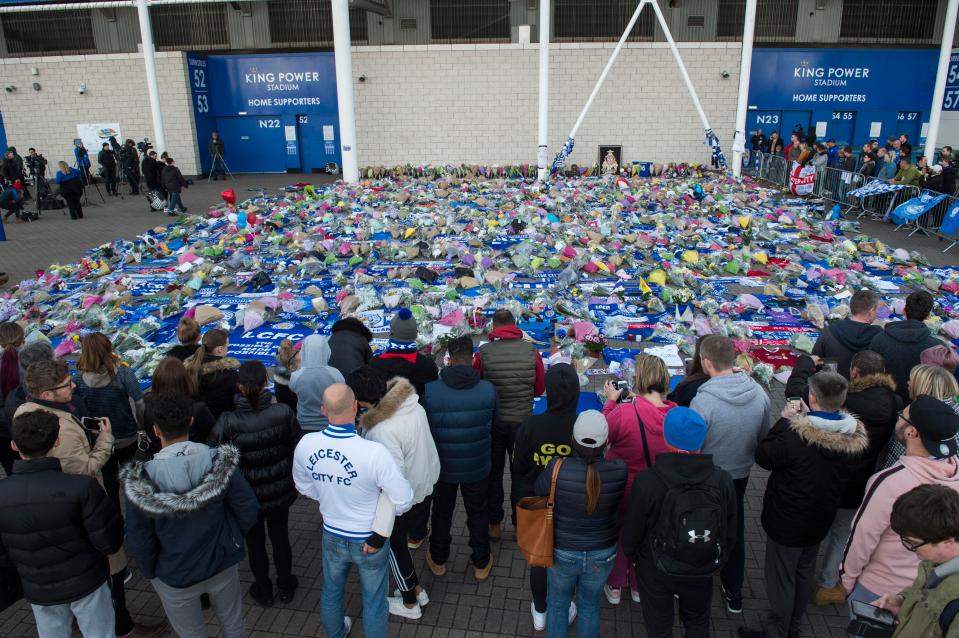  Leicester City fans lay flowers outside the ground after tragic helicopter crash