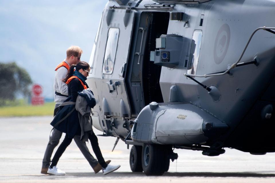  The couple board a New Zealand Air Force NH90 helicopter to fly to the next stop on their tour