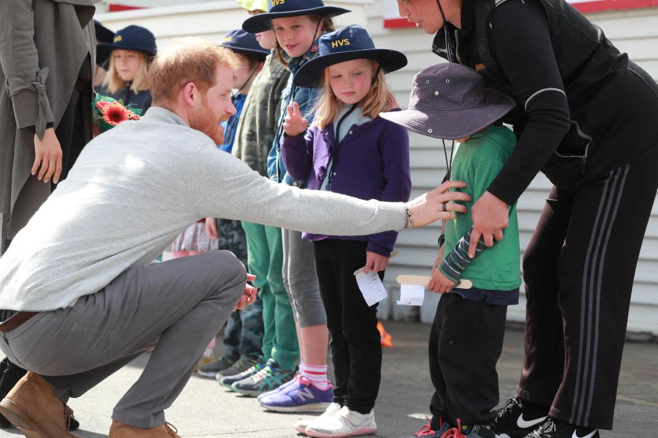  Shy Joe Young got a tummy tickle from Prince Harry when he met the royal couple outside a cafe in Wellington