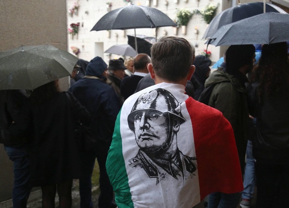 One supporter draped himself in the Italian flag with a drawing of the dictator on it