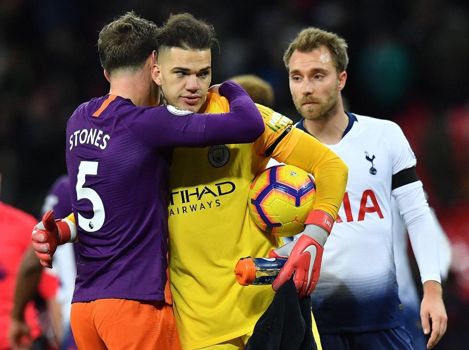  Stones and goalkeeper Ederson celebrate the victory which took the Premier League champions back to the top of the table