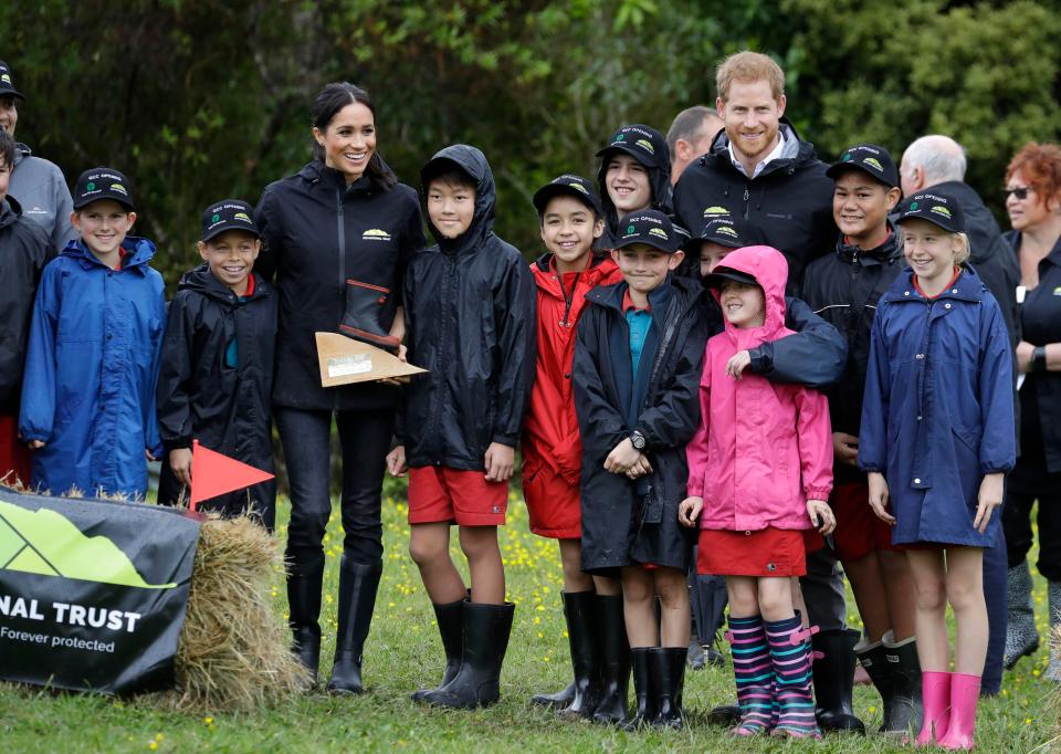  Meghan's pink team celebrates beating Prince Harry's welly wangers