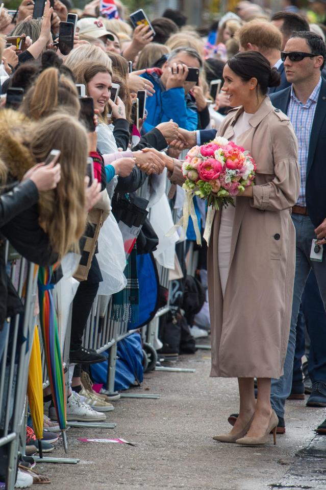  Meghan gets handed a beautiful bouquet of flowers