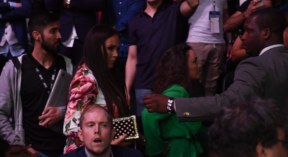  Pregnant Dee Devlin is escorted from the arena after partner Conor McGregor is involved in brawl