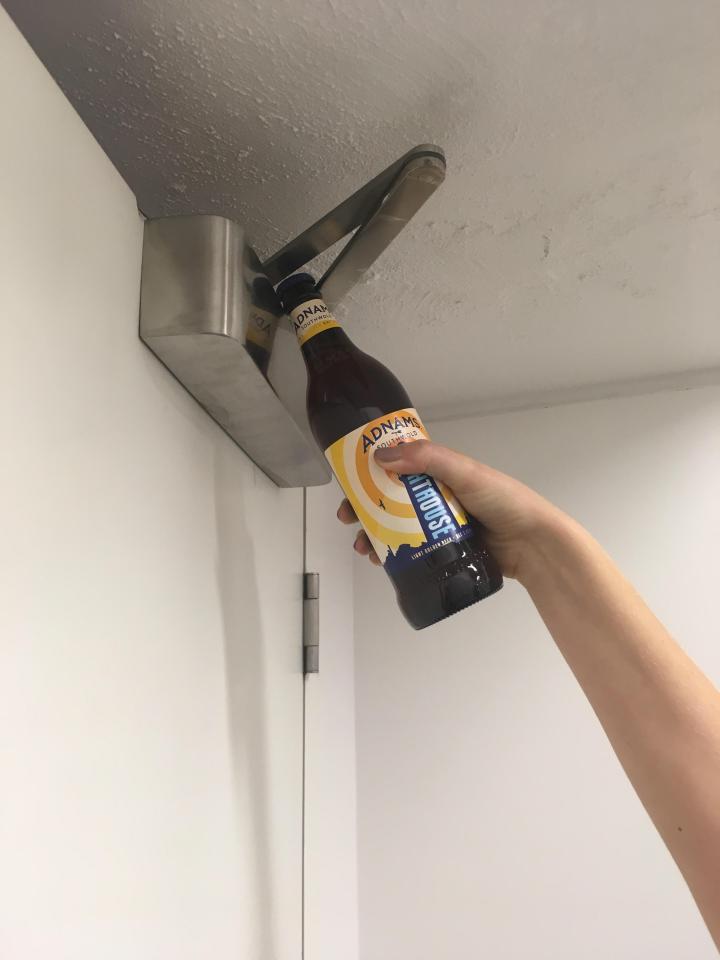  You can pop the cap off a beer bottle by using the hinge on a fire door