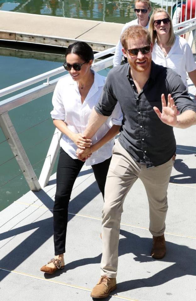  Prince Harry and Meghan pictured as they left Australia this morning