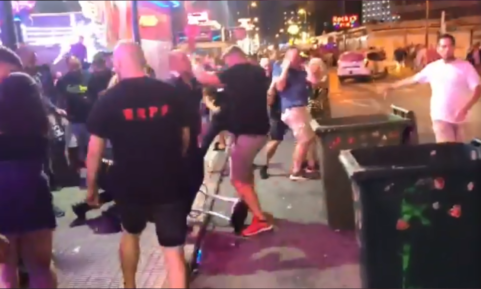  As the fight erupts the video just captures a second man in a blue shirt being taken down from behind by a man in a black tee