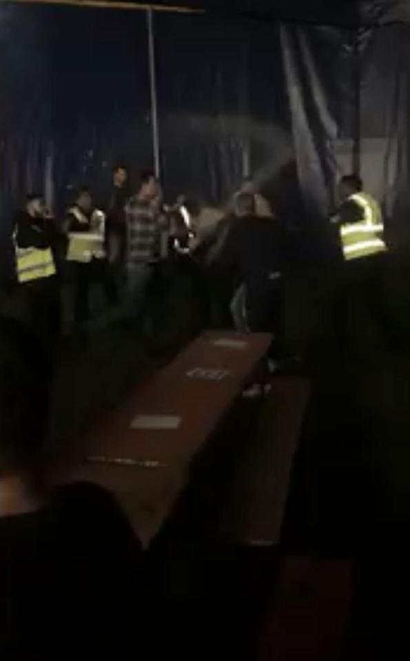  A glass of beer is being smashed over someone's head