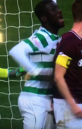  Steven MacLean grabs Eboue Kouassi's privates