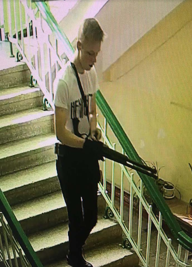 In this image student Vladislav Roslyakov, 18, can be seen stalking the halls during his murder spree