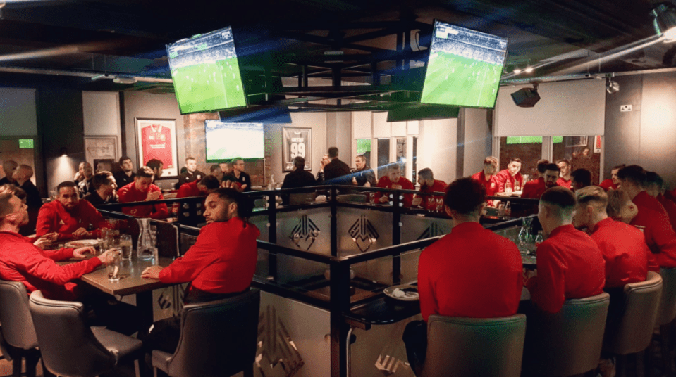  The Wales squad crammed into the sports bar in Cardiff to watch Ireland play against Denmark