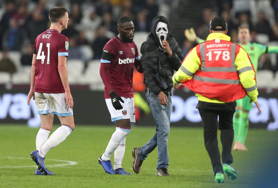  One of the men who invaded the pitch last night has been charged