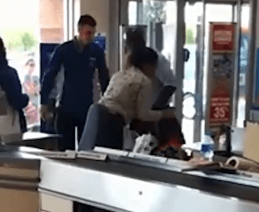  The mum tried to ram past the man inside the Aldi store