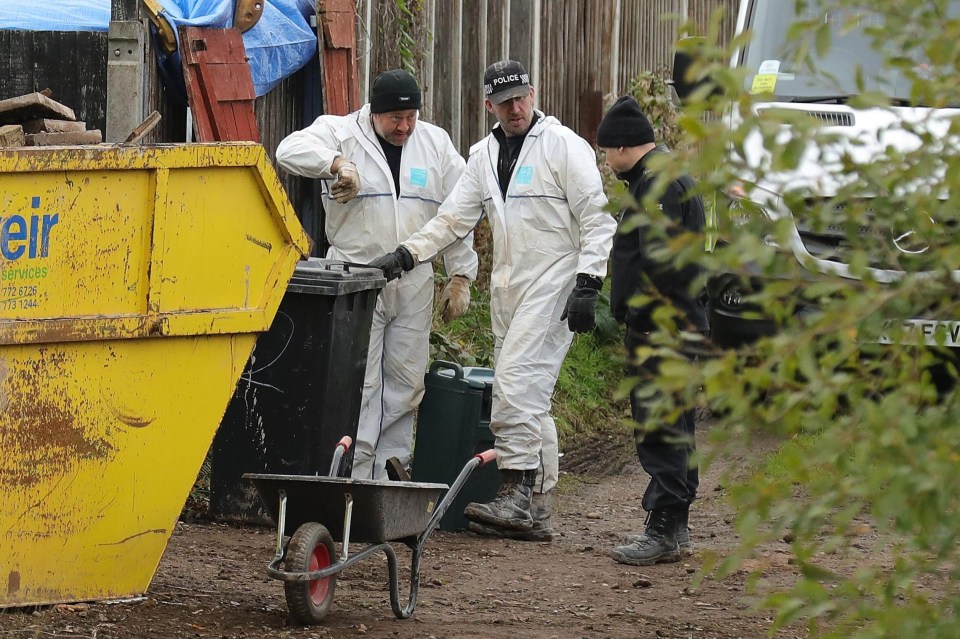 Officers at the rear of the property at No 1 Shipton Road in Sutton Coldfield, West Midlands