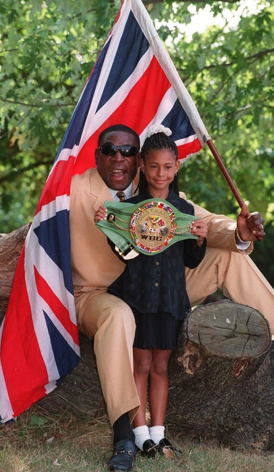  Rachel holds Bruno's heavyweight title belt in a photo shoot with Sun Sport