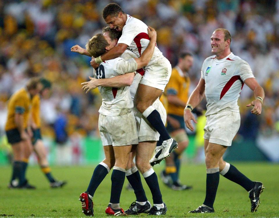  Lawrence Dallaglio, right, joins in the celebrations as England become world champions