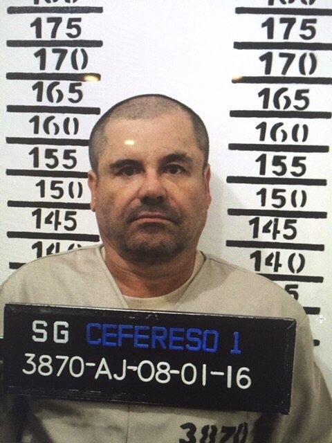 Mexico's drug lord Joaquin "El Chapo" Guzman stands for his prison mug shot