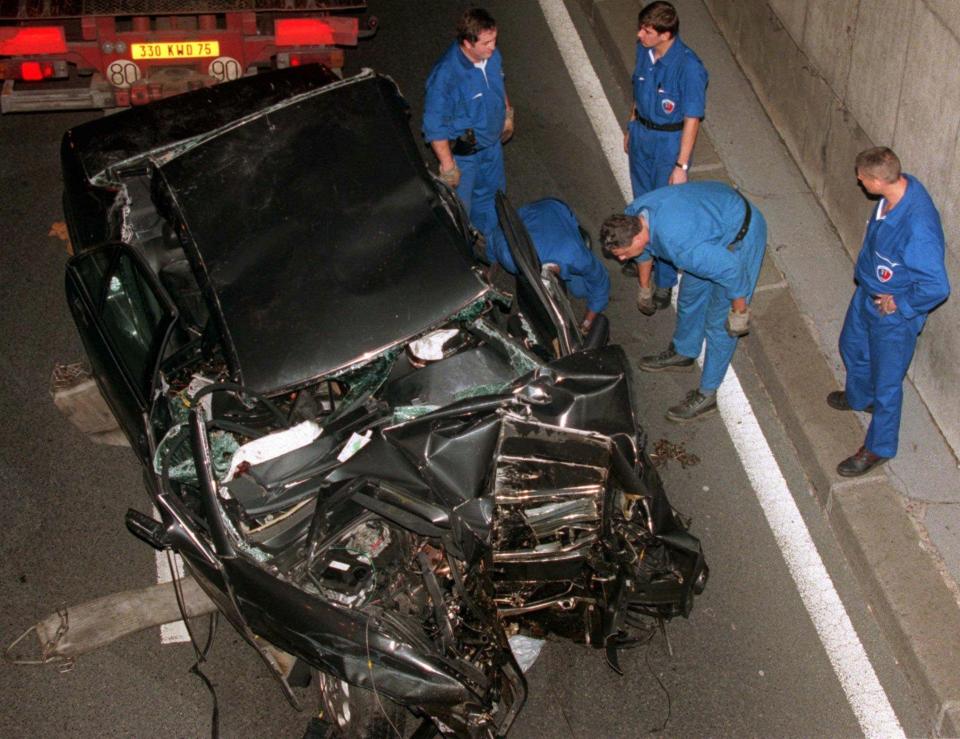  Investigators at the scene of the fatal crash