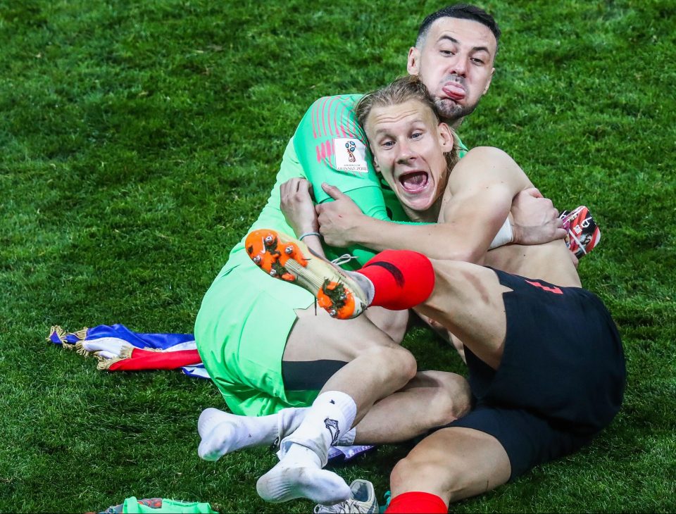  Danijel Subasic and Domagoj Vida, right, enjoy beating England in Russia