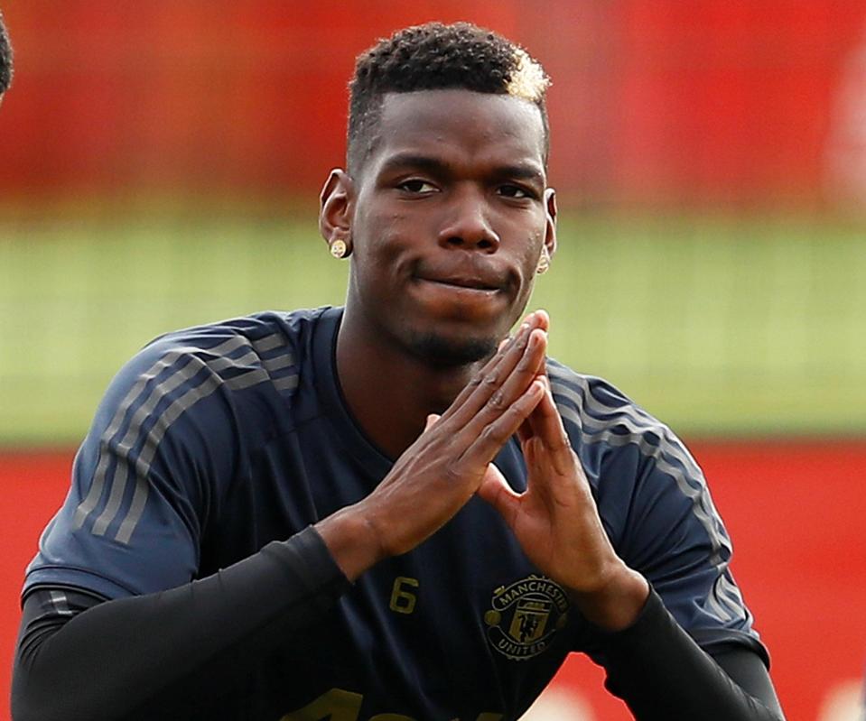  Pogba shows off his gold plated emoji earrings